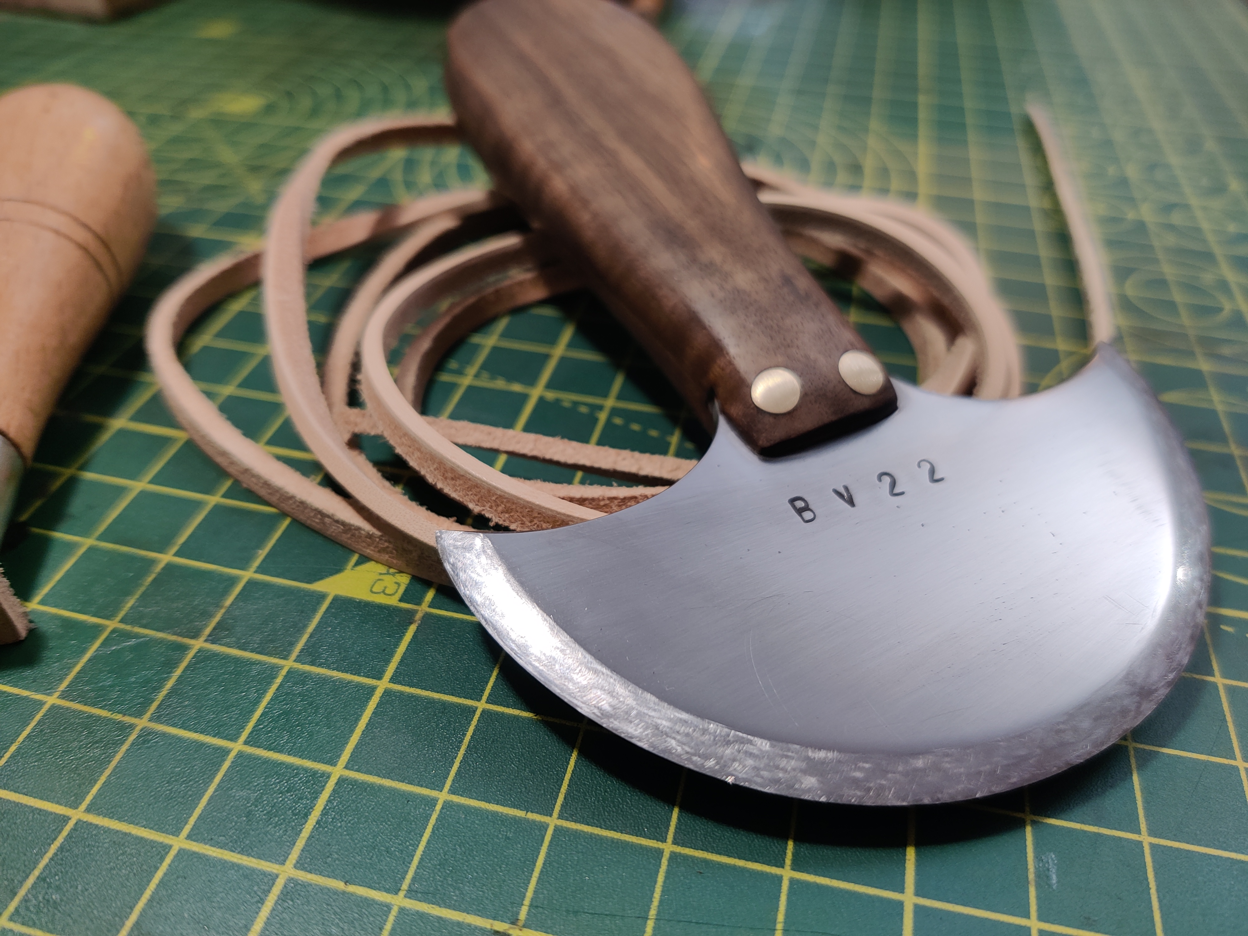 an image of a round knife from a different angle
