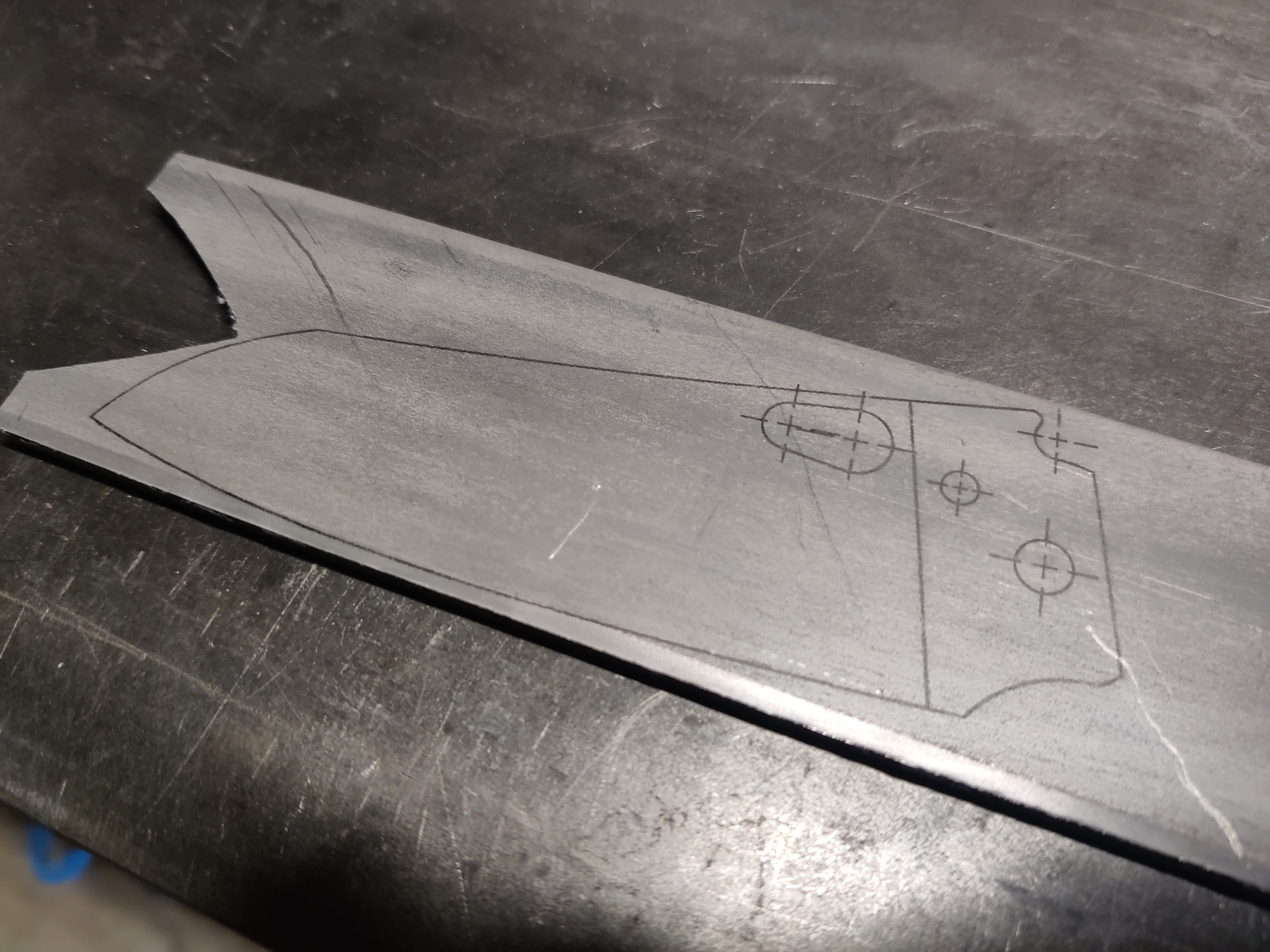 an image of a piece of metal with lines on it