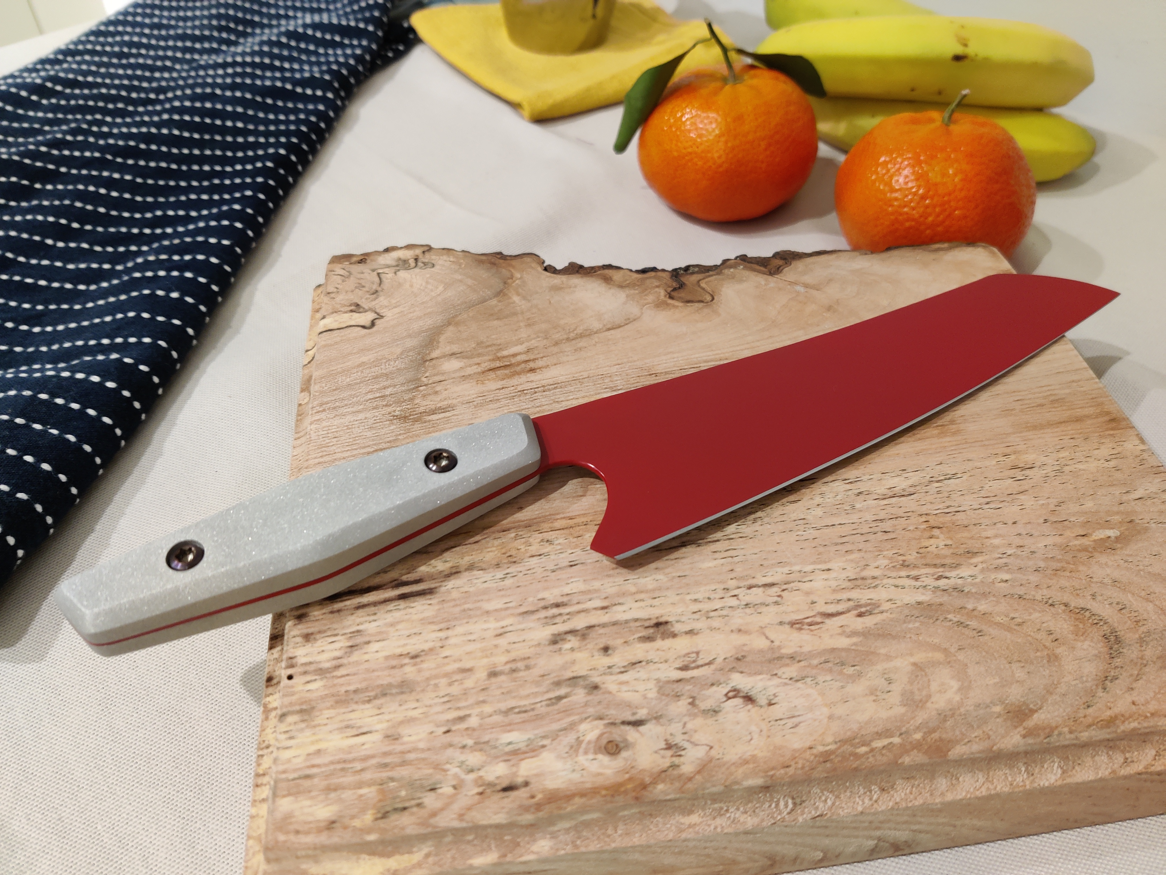an image of a red kitchen knife